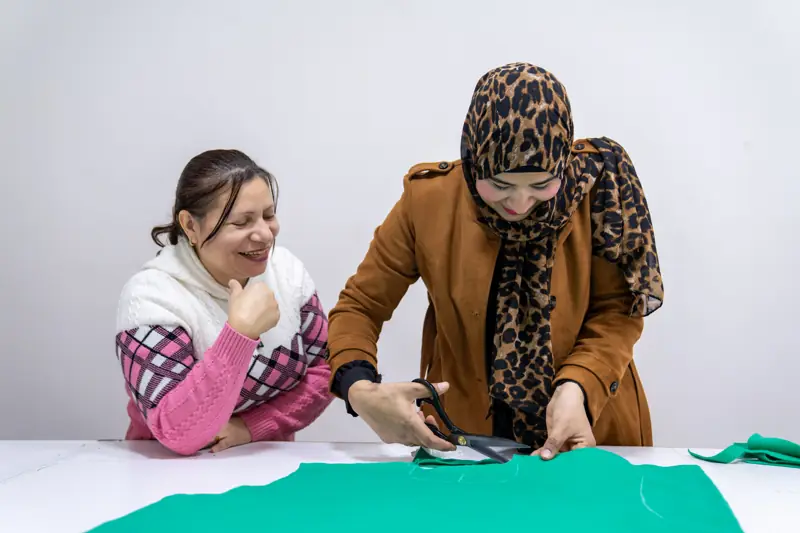 Laughter while cutting fabric together