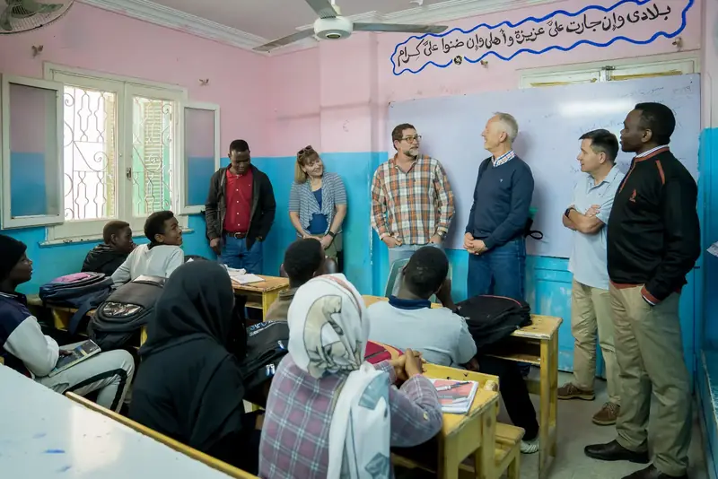 Partners and staff at Impact’s programs and sewing factory