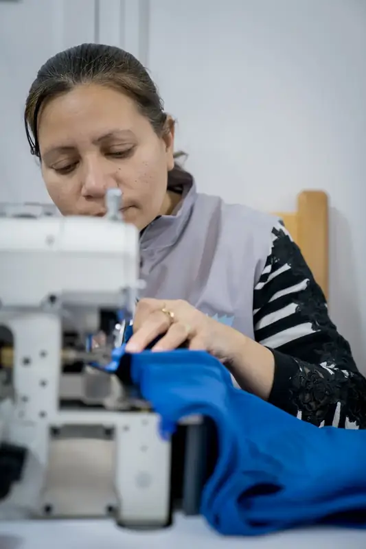 Partners and staff at Impact’s programs and sewing factory