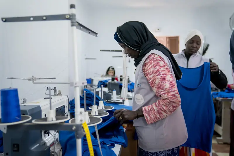 Partners and staff at Impact’s programs and sewing factory