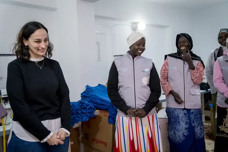 Partners and staff at Impact’s programs and sewing factory
