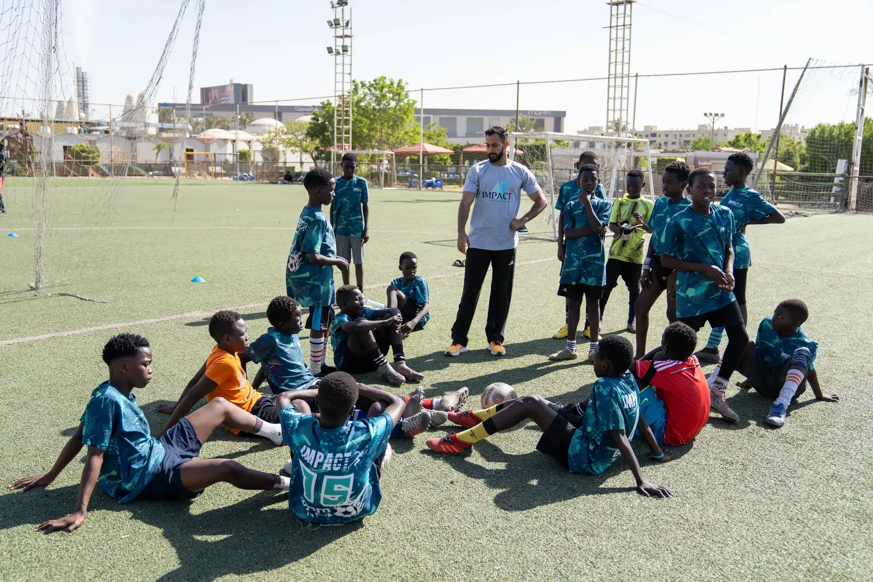 Players rest and listen during training