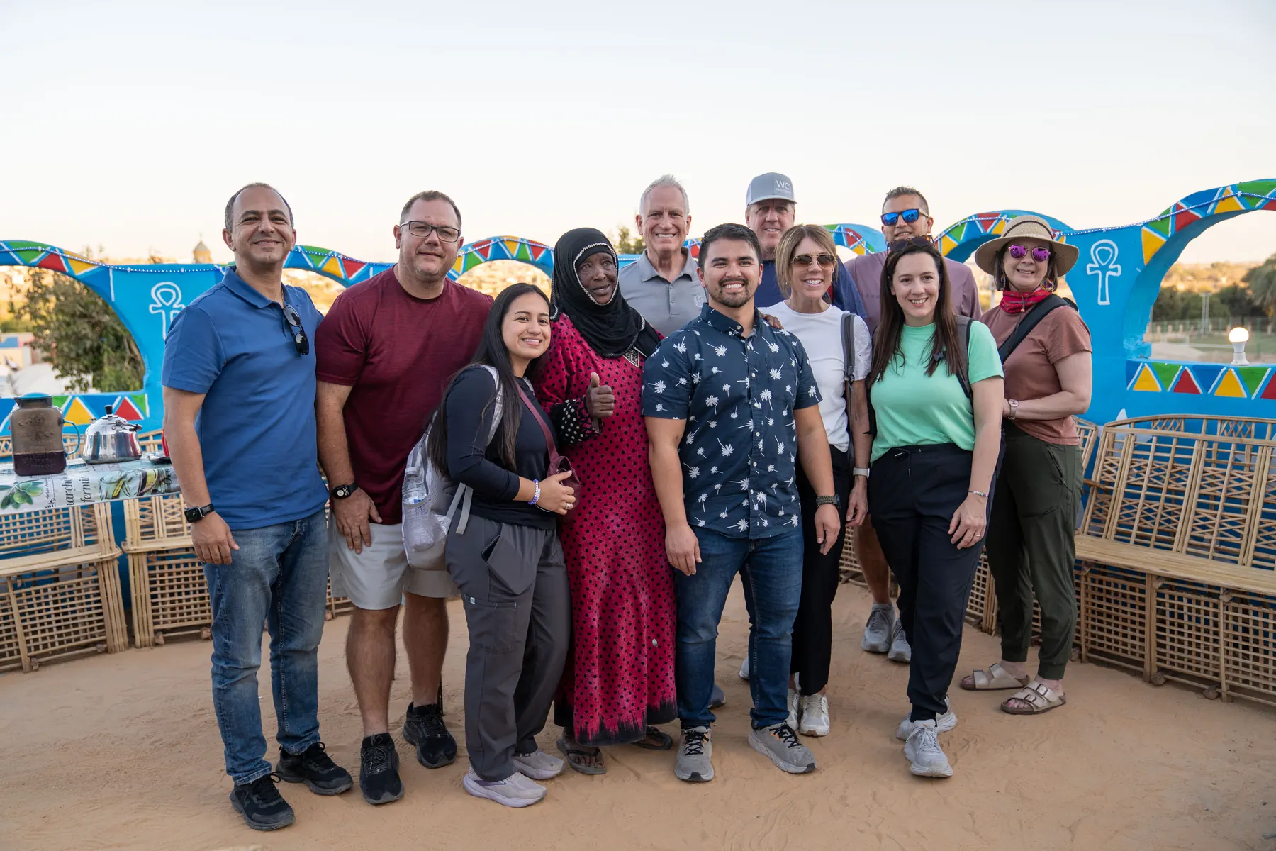 The Impact team and partners with a host in a Nubian village near Aswan