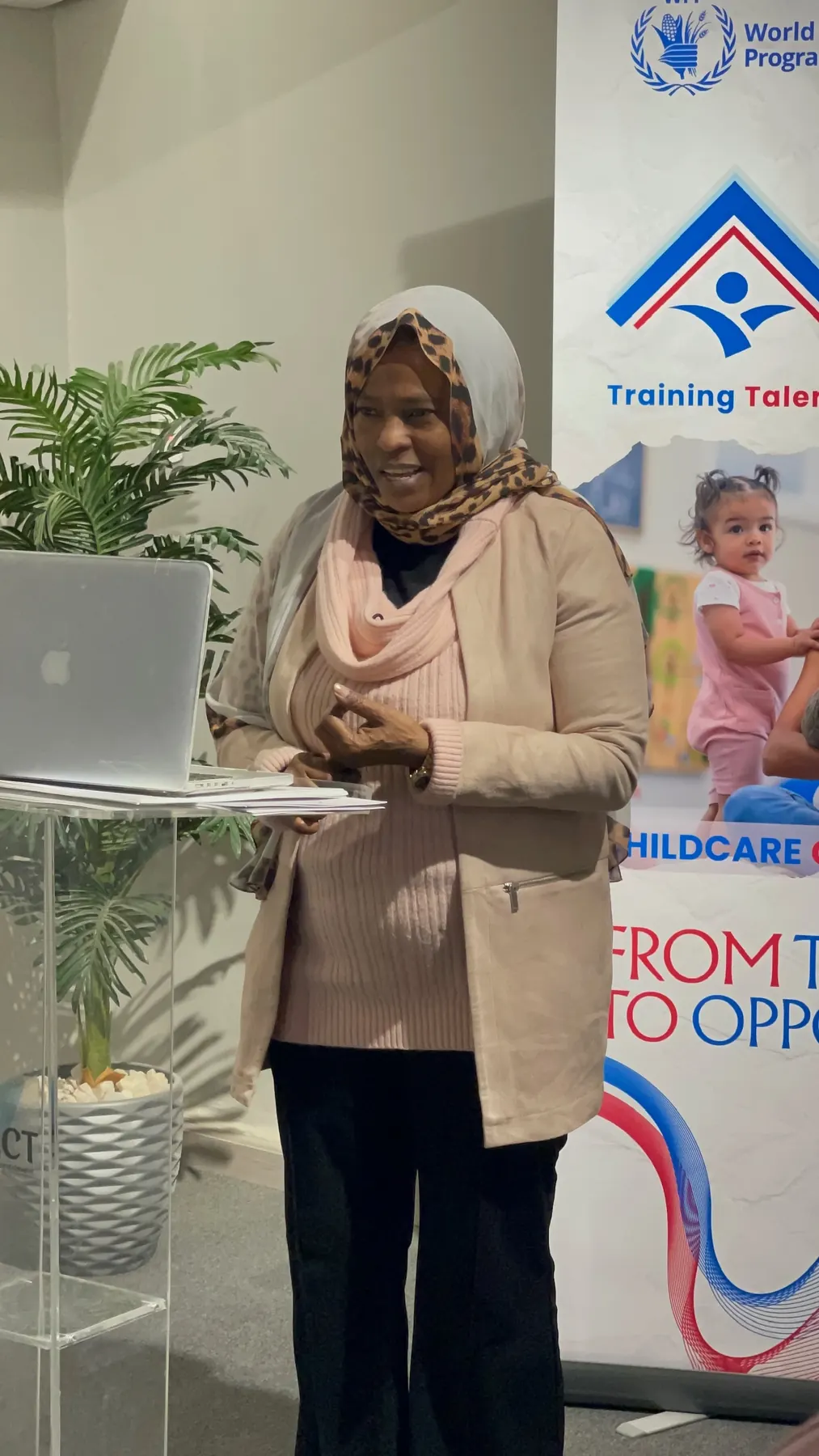 A trainer presents during the child caregiving program
